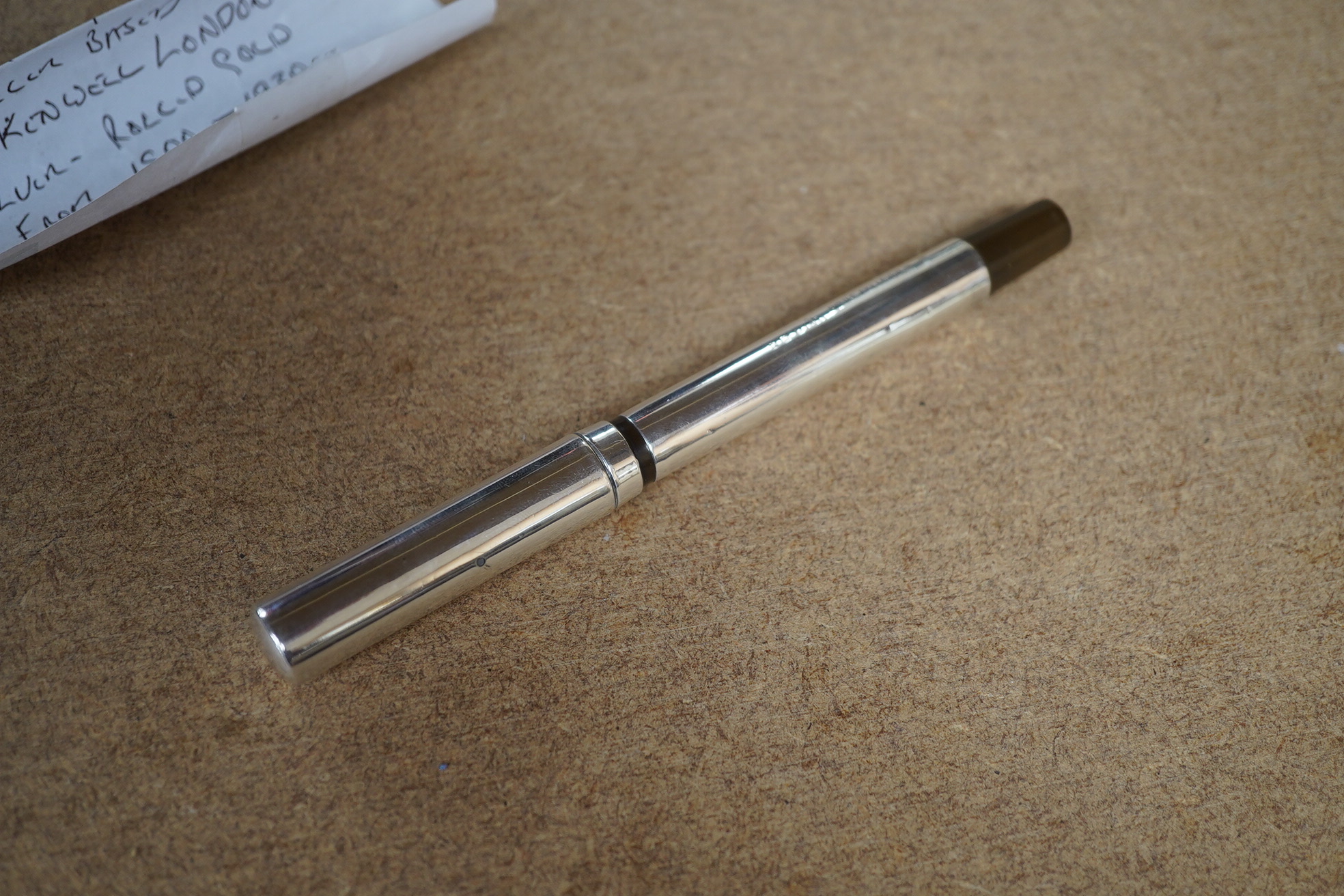 A Battle Axe lever fountain pen in silver, with 14ct gold nib, 14cm in length. Condition - fair